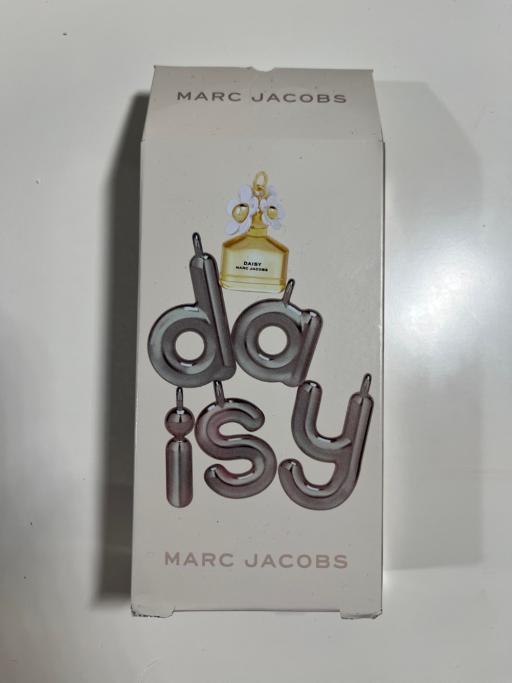 Marc Jacobs Daisy 🌼 miniature lotion, and perfume set.